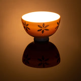 Charming Floral Night Light Bowl with hand carved flower design which are hand painted with a blue colour, lit