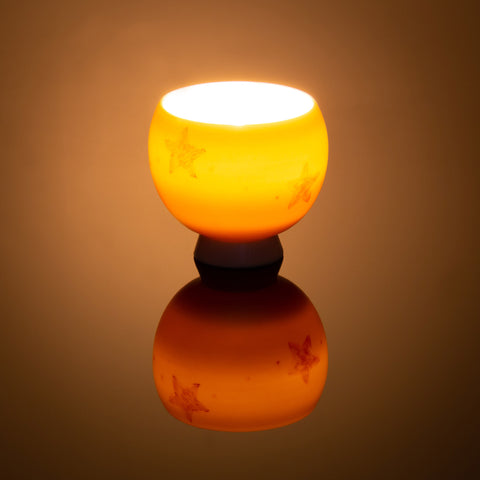 Beautiful translucent Night Light Bowl with hand painted golden brown star design, lit